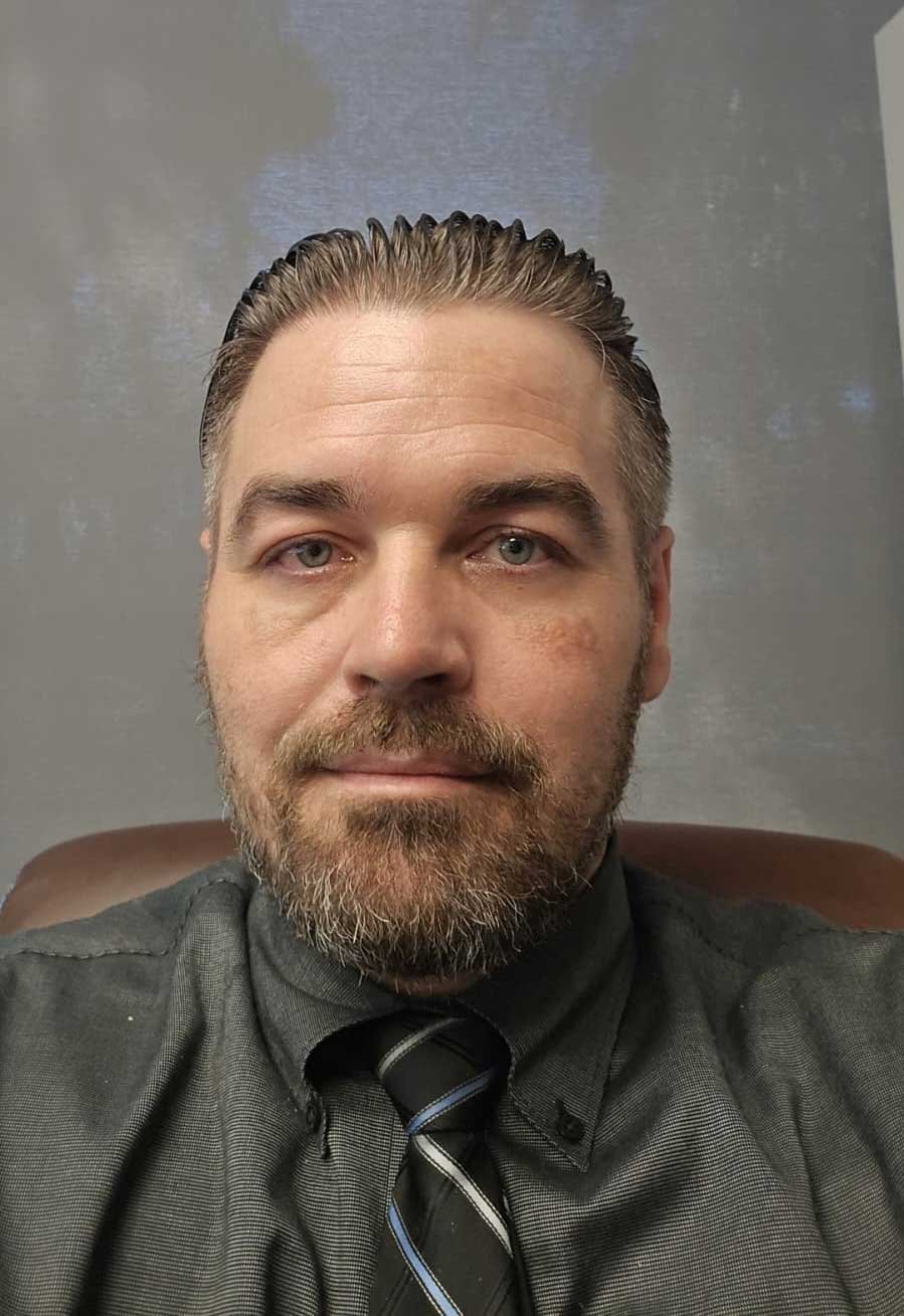 Young female teacher assistant smiling